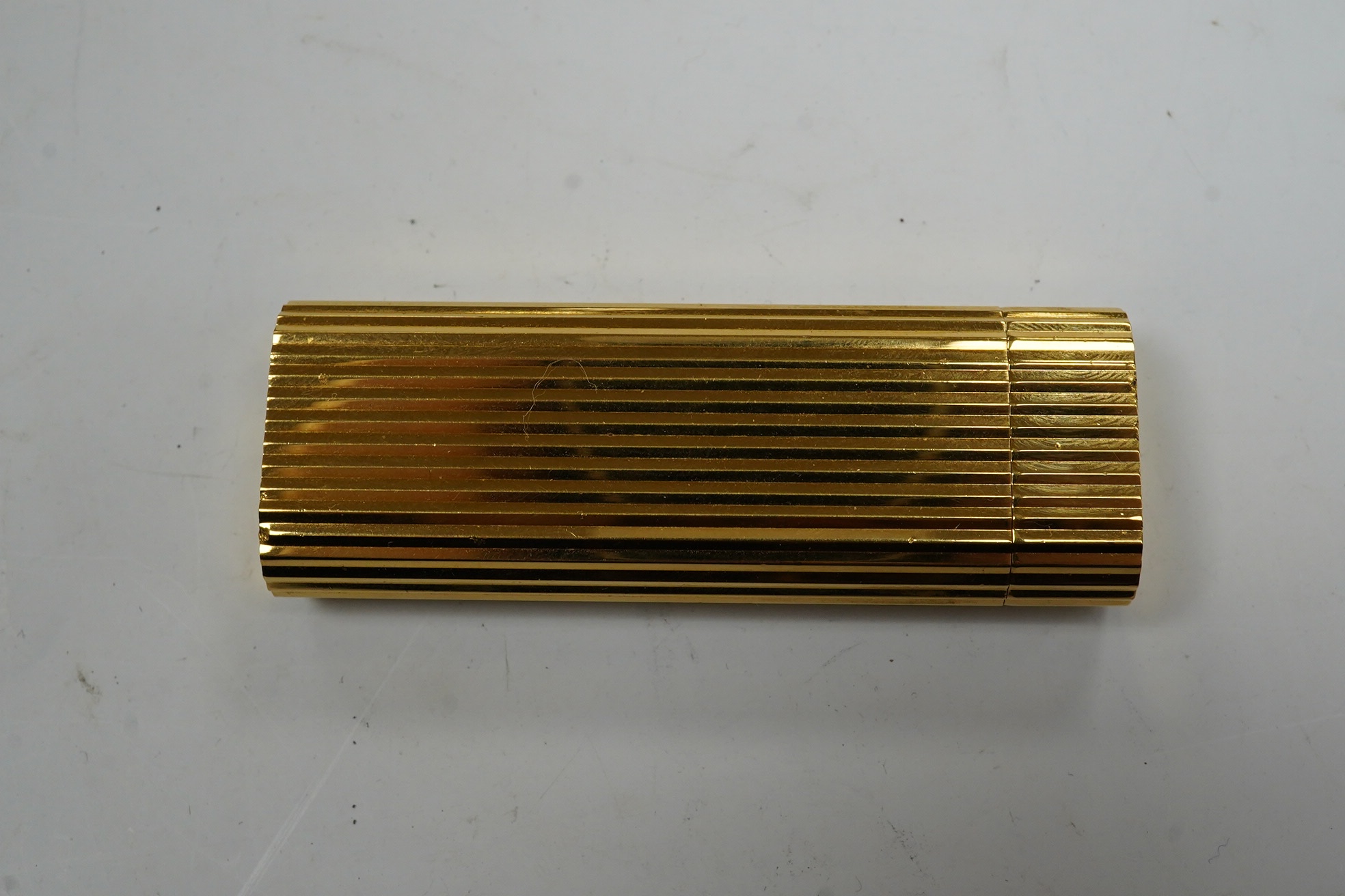 A Dunhill Sylphida lighter and Cartier lighter, numbered 88821. Condition - fair